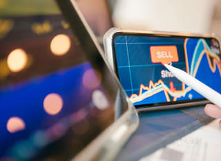 Trader across multiple markets examining Bitcoin, Ethereum, and foreign exchange options